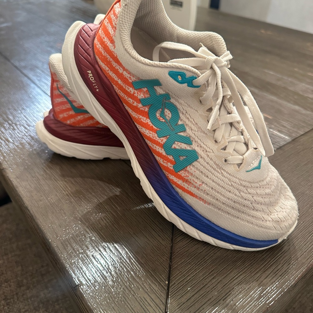 Hoka White and Orange Athletic Shoes with Blue Accents
